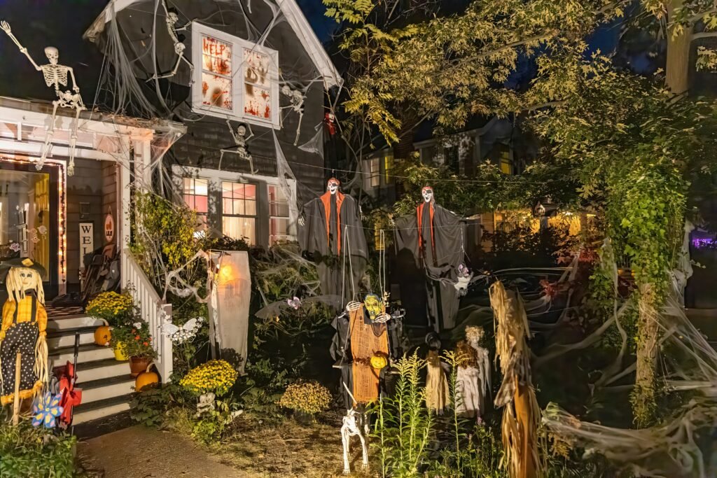 Skeletons and pumpkins on halloween front porch steps