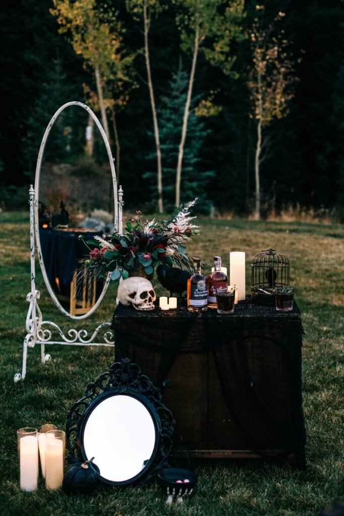 Scary Halloween decor with candles, skull, and dark gothic accents