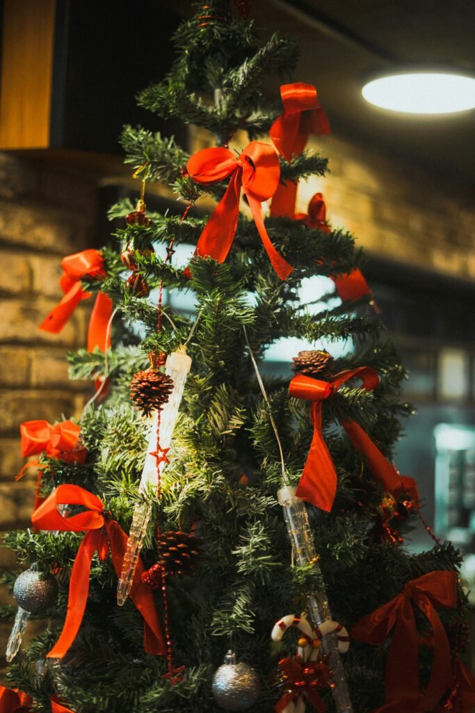 how to decorate a christmas tree with ribbon - wire-edged ribbon woven diagonally through branches